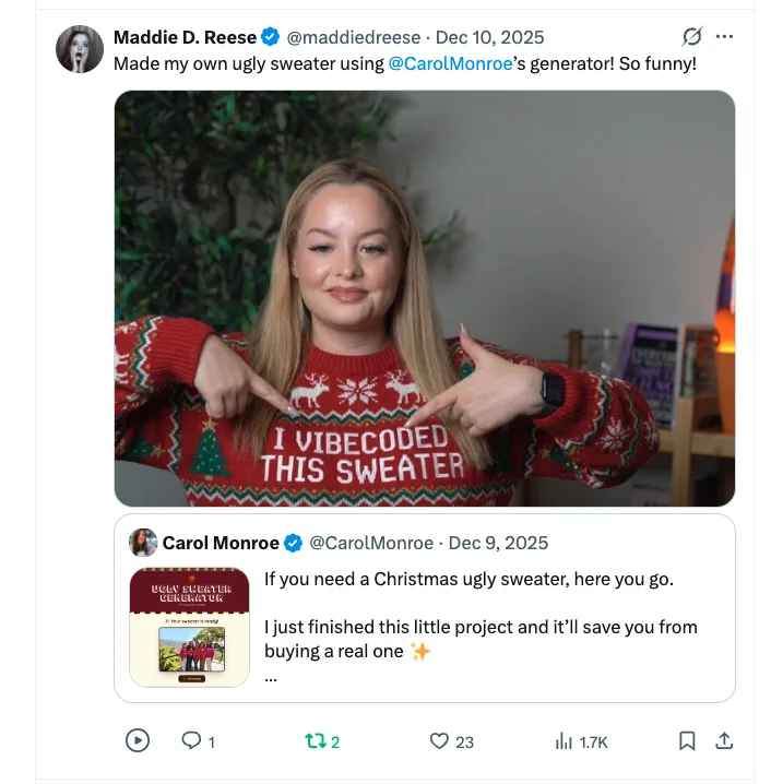 Maddie D. Reese wearing a sweater that reads I vibecoded this sweater